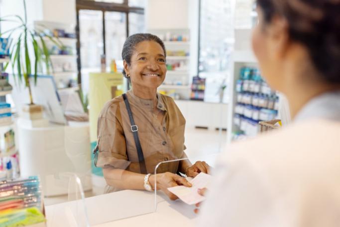 Woman Buy Prescriptions at the Pharmacy